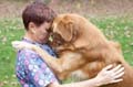 Sammie and her Golden hugging
